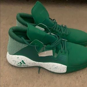 Green and white adidas